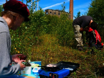 Inspecting an avocado after camping out
