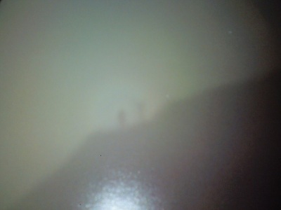 Shadow on top of clouds with a rainbow around us